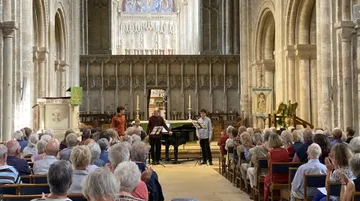 Musicians playing in the Priory at Christchurch